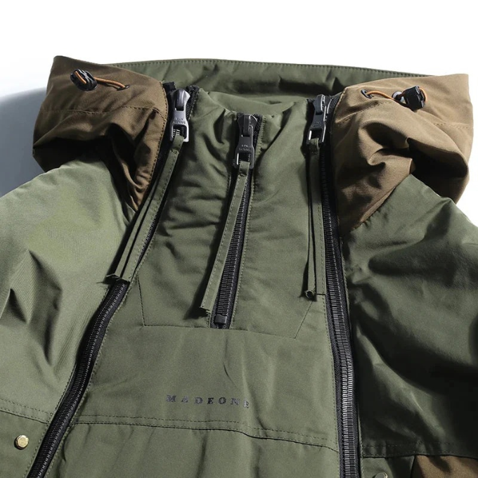 Men's Vector multi-zipper techwear jacket, insulated & water-resistant, essential for cold weather urban fashion.