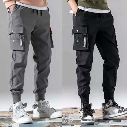 Stylish stealth black men's cargo joggers with multiple pockets. Perfect for a casual athletic look.