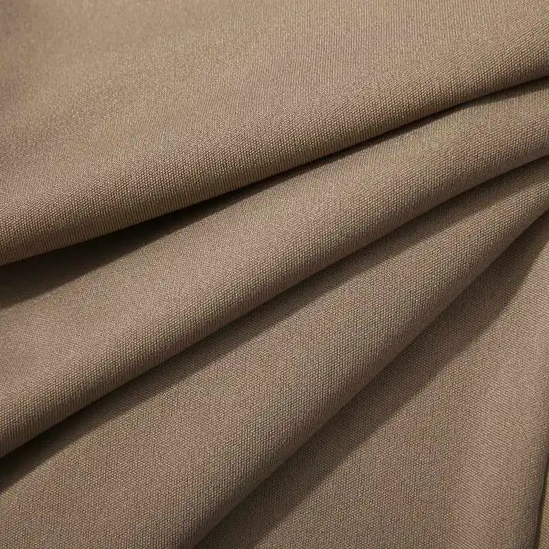 Stack of Men's Verona Classic Pleated Trousers in black, white, khaki. Versatile classic tailored pants for men.