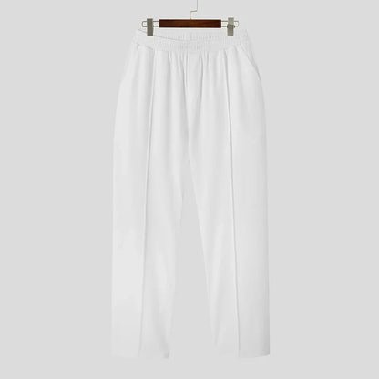 Man wearing Khaki Verona Classic Pleated Trousers. Casual style with comfortable tailored fit men's pants.