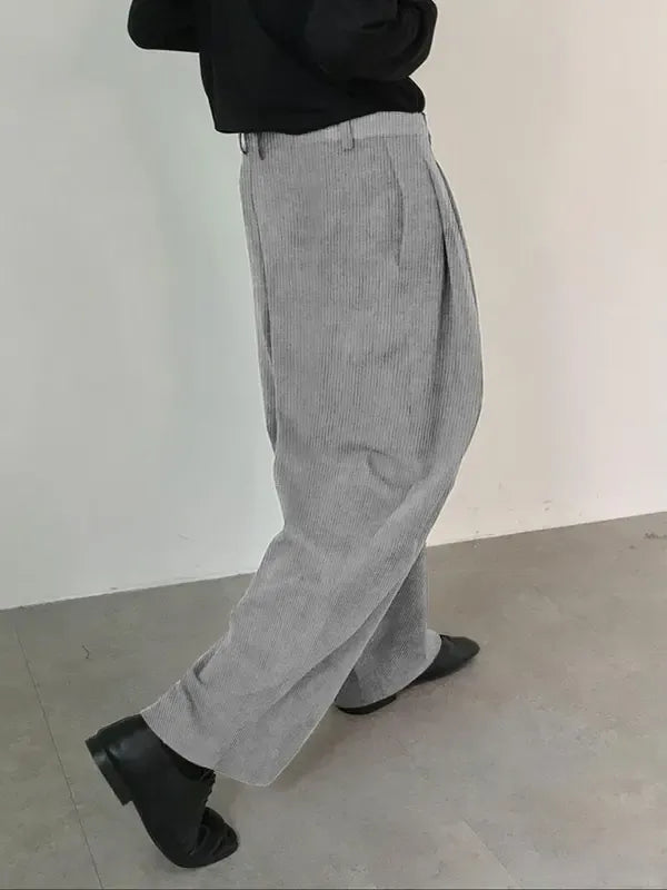 Men's tailored wool blend pleated trousers, ideal for a refined formal or casual chic outfit.