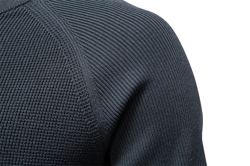 Men's waffle knit sweater texture detail, highlighting the cozy, rich waffle pattern.