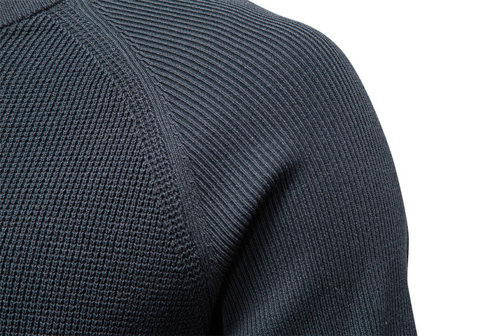Men's waffle knit sweater texture detail, highlighting the cozy, rich waffle pattern.