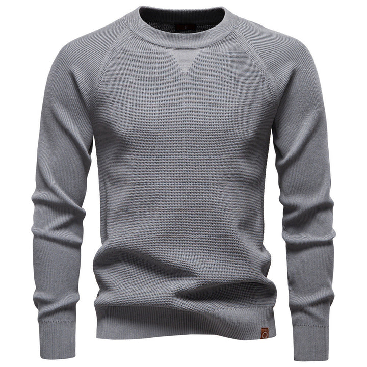 Textured waffle knit men's sweater, long sleeve, crew neck, offering cozy comfort and style.