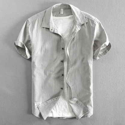 Classic men's button-up shirt, breathable and comfortable for everyday wear. Ideal versatile top for spring & summer.
