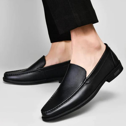 Brown leather men's slip-on loafers, perfect for versatile everyday styling.
