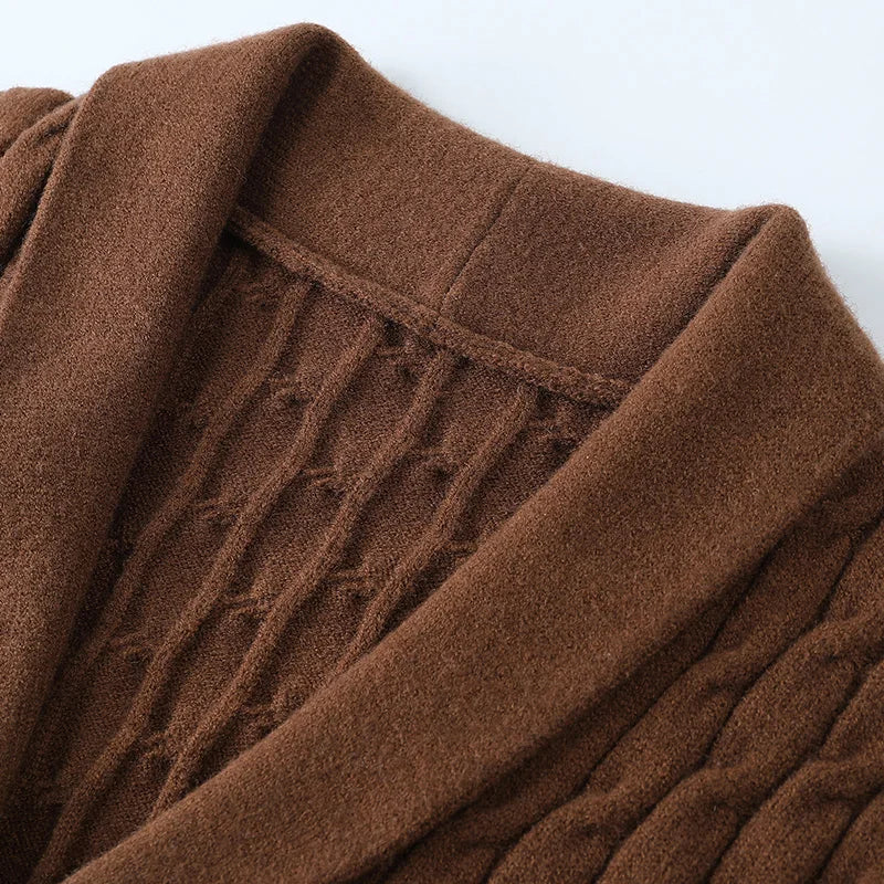 Textured knit men's button-up cardigan. Versatile long sleeve sweater for smart casual layered looks.