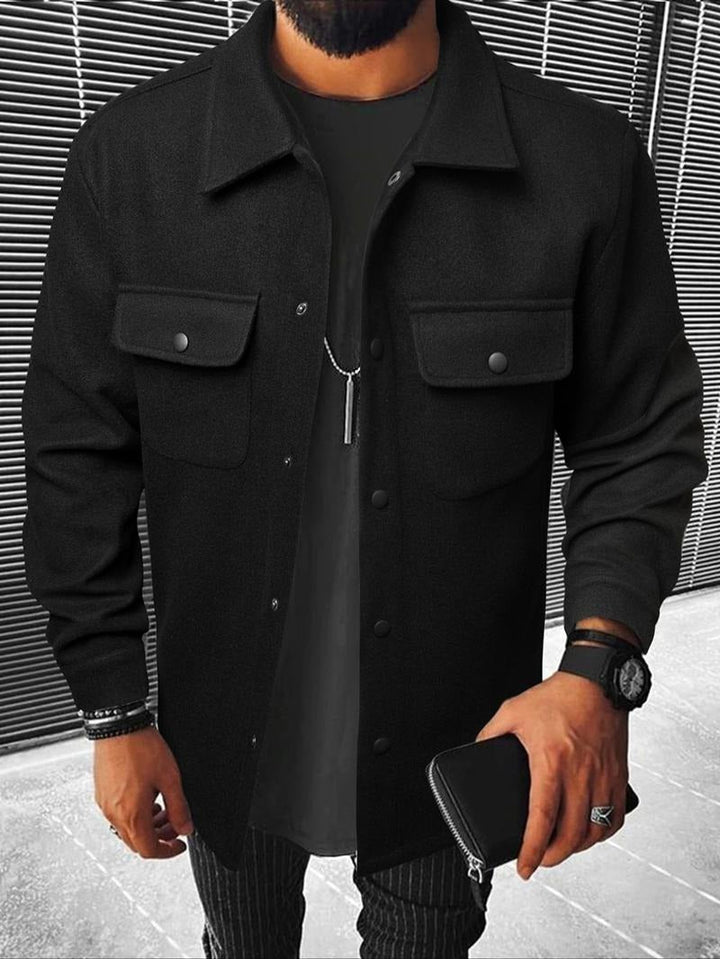 Close-up of men's casual overshirt jacket, highlighting snap closure & tailored detail. Versatile for layering.