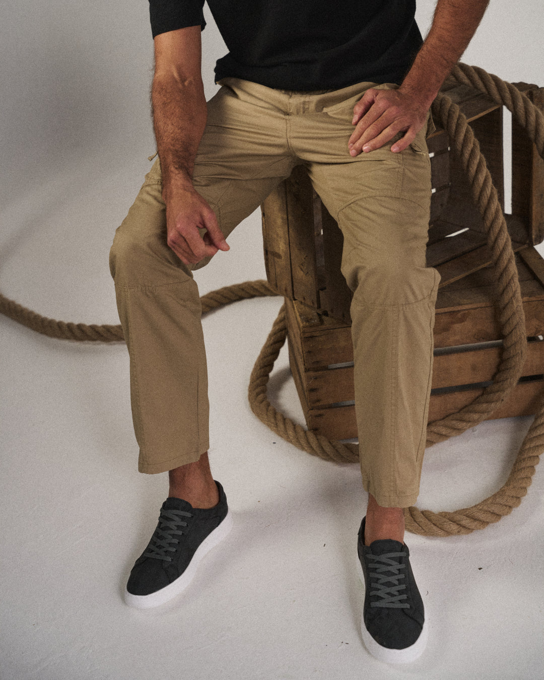 Men's multi-pocket cargo pants, side view, highlighting the practical design and relaxed fit for casual utility wear.