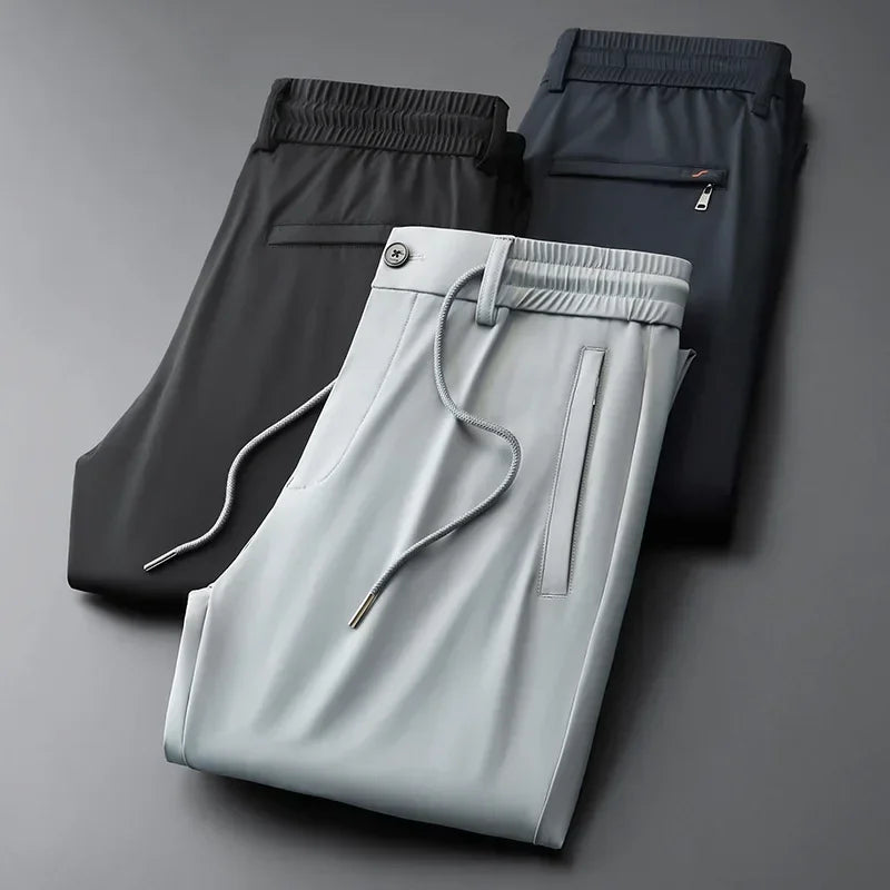 Men's comfort trousers with drawstring waist for ultimate versatility. Easy-care modern fit pants for travel & daily wear.