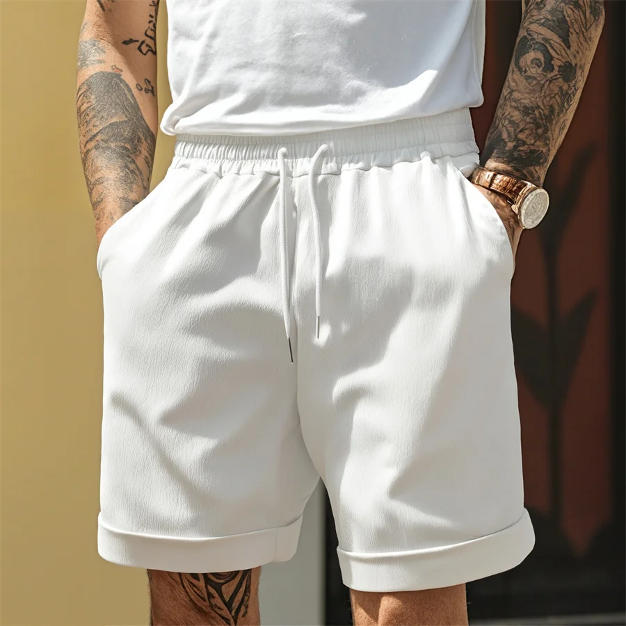 Close-up of men's comfortable cuffed shorts, showcasing breathable fabric & stylish cuff detail for warm weather.