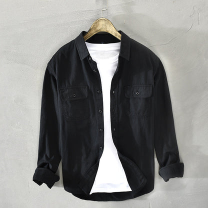 Comfortable men's everyday button-down shirt, long sleeve, featuring chest flap pockets for a relaxed look.