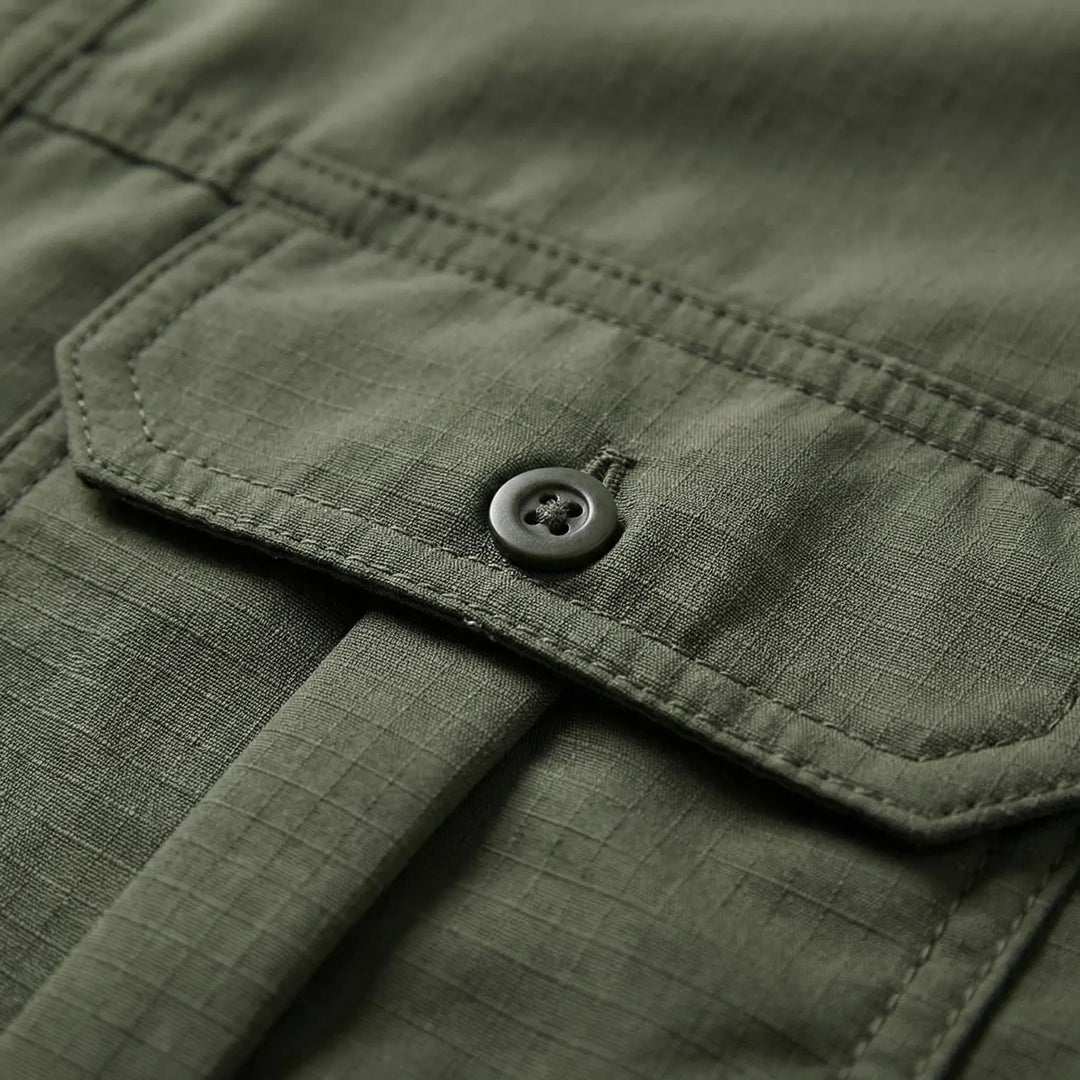 Breathable men's adventure shirt with zip-off sleeves for hot weather, great for camping and travel.