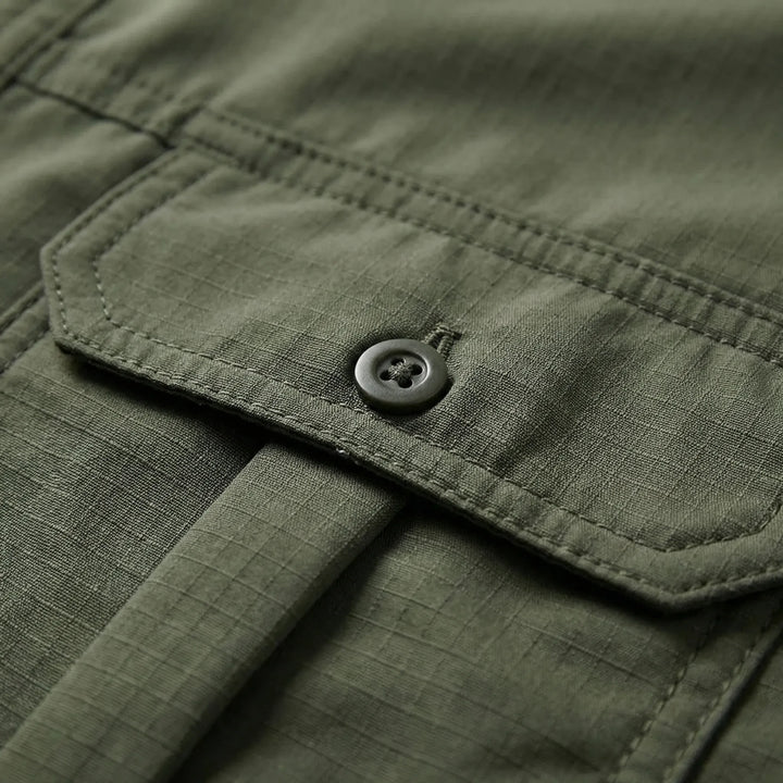 Breathable men's adventure shirt with zip-off sleeves for hot weather, great for camping and travel.