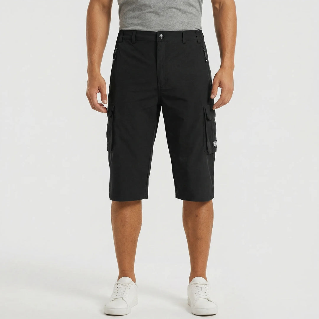 Man wearing casual quick-dry cargo shorts. Stylish men's summer fashion with practical multi-pockets for everyday.