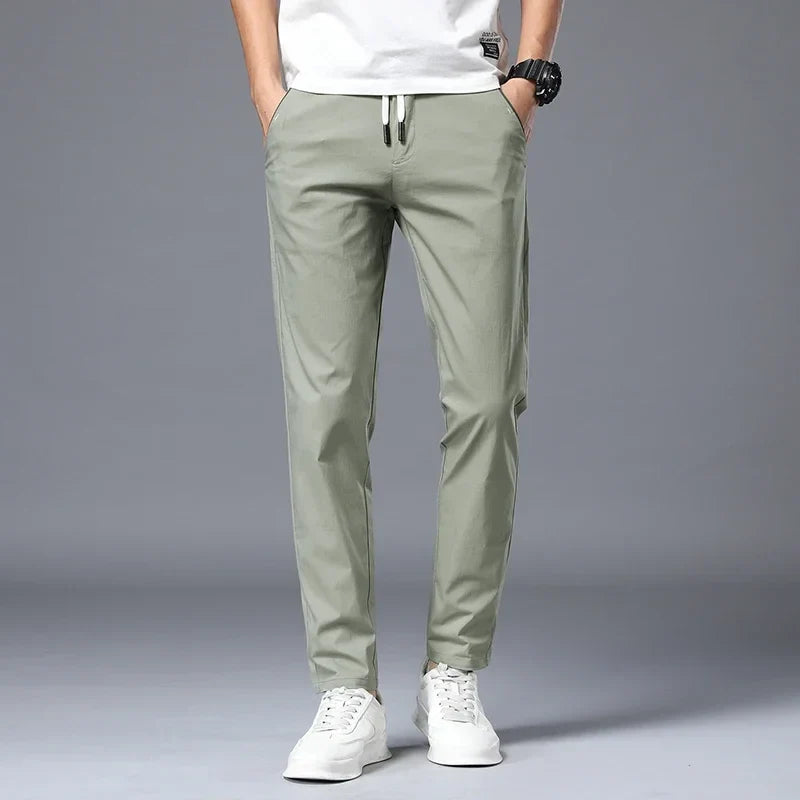 Comfortable men's stretch slim fit pants, ideal for casual wear or dressing up, wrinkle-resistant.