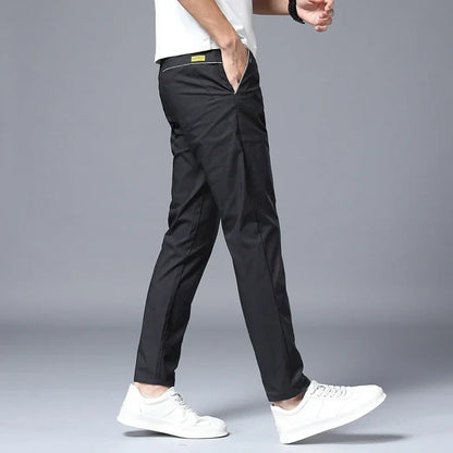 Close-up of fabric on men's wrinkle-resistant slim fit pants, showcasing stretch and comfort.