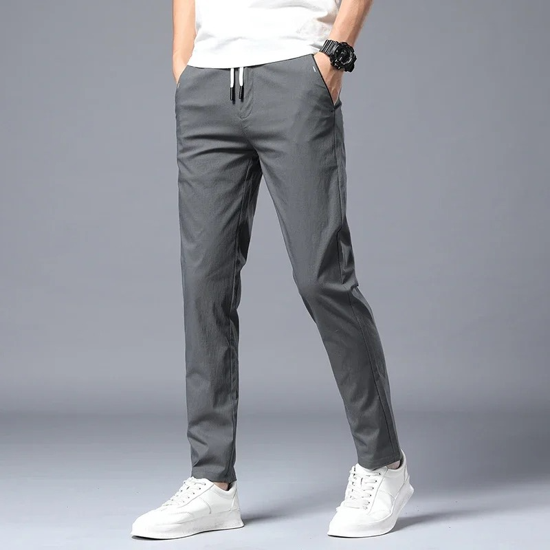 Modern men's slim fit dress pants with stretch, designed for all-day comfort and a sharp, versatile appearance.