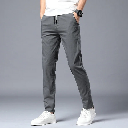Modern men's slim fit dress pants with stretch, designed for all-day comfort and a sharp, versatile appearance.