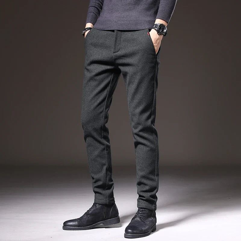 Black men's tailored stretch pants, offering a sleek slim fit for versatile occasions.
