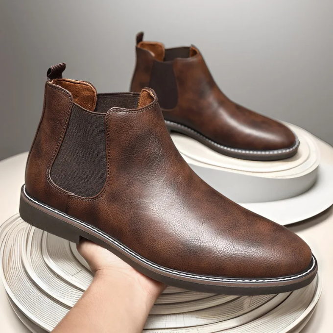Classic black men's slip-on Chelsea boots, ideal for smart casual or formal looks.