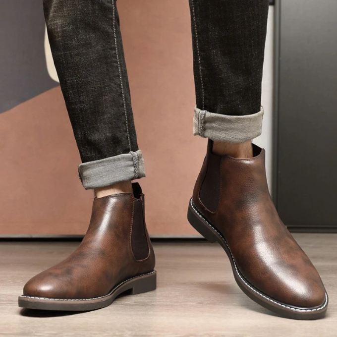 Durable men's ankle boots, versatile Chelsea style with elastic sides for comfort.