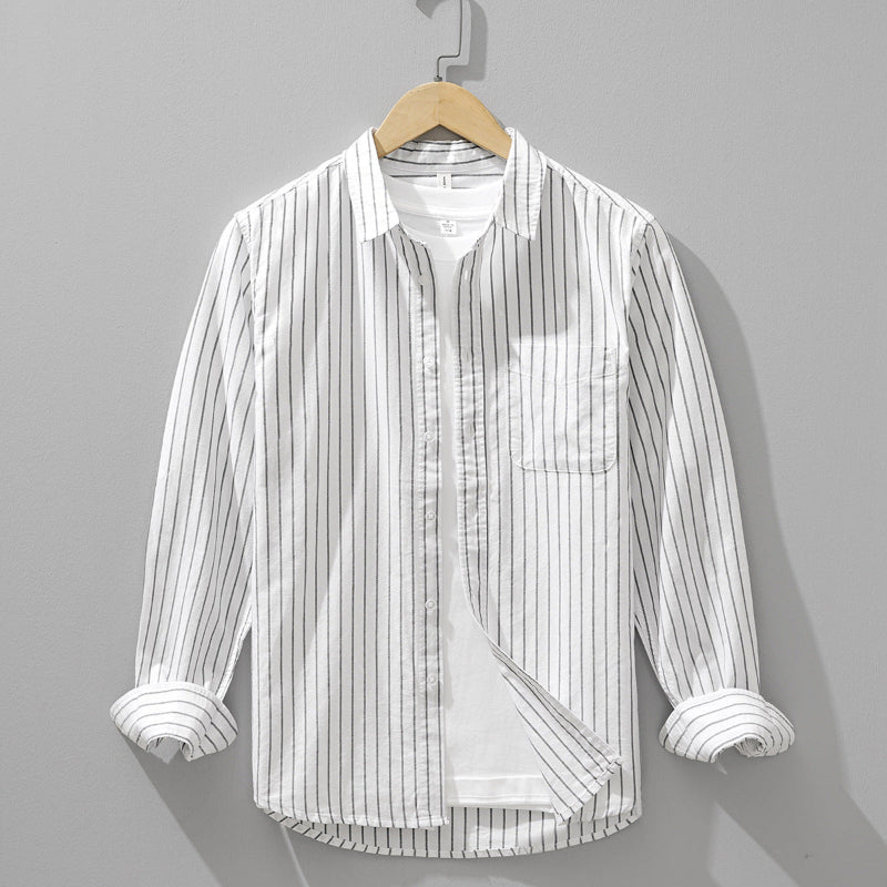 Stylish men's long sleeve button-down shirt with a classic striped pattern. Great for casual or smart-casual outfits.