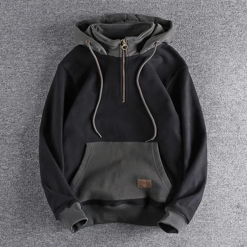 Everyday men's quarter-zip apparel. A comfortable, two-tone zipper hoodie, perfect for versatile casual and urban outfits.