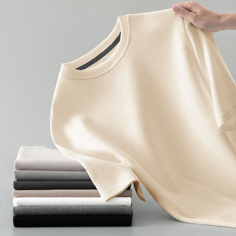 Close-up of the comfortable men's waffle knit long sleeve tee, showcasing its textured fabric and quality.