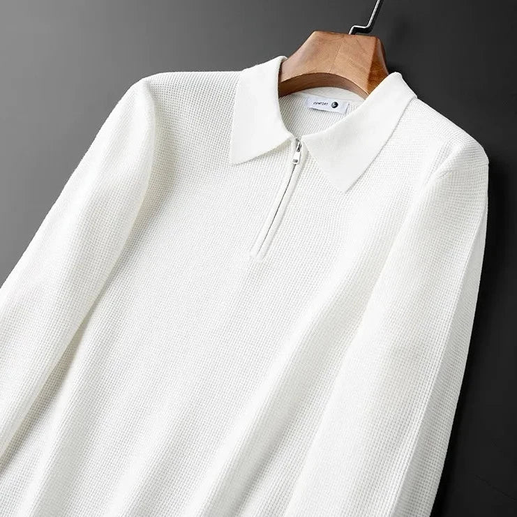 Detail of the stylish quarter-zip collar on a men's waffle knit long-sleeve top, adding a modern touch to casual wear.