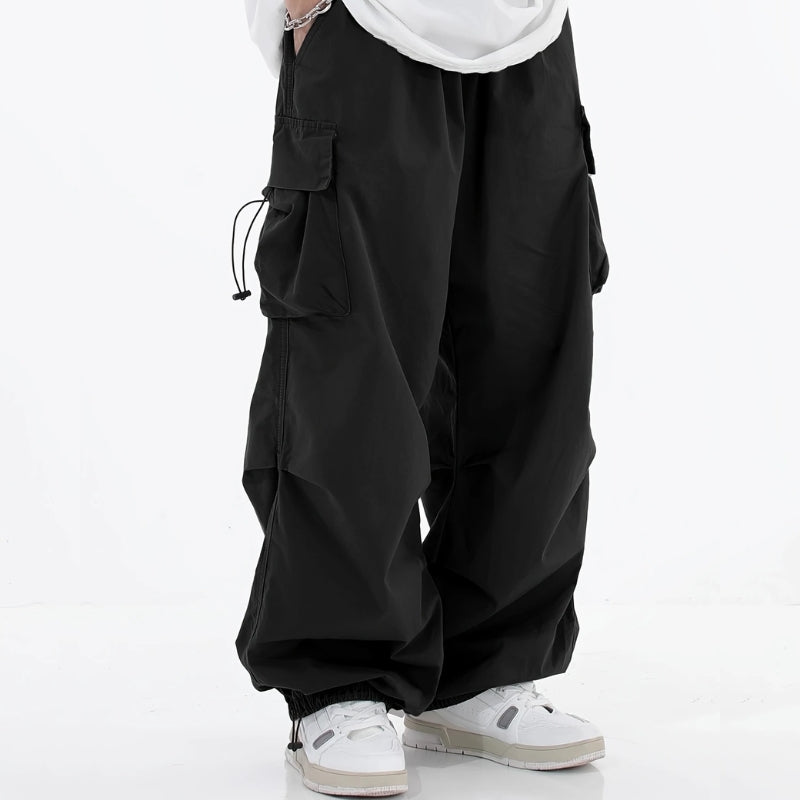 Men's wide-leg cargo pants with drawstring cuffs, perfect for urban fashion.