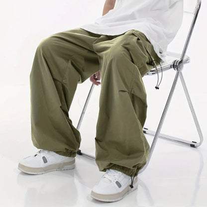 Black men's wide-leg cargo pants, designed for urban streetwear with a comfortable feel.