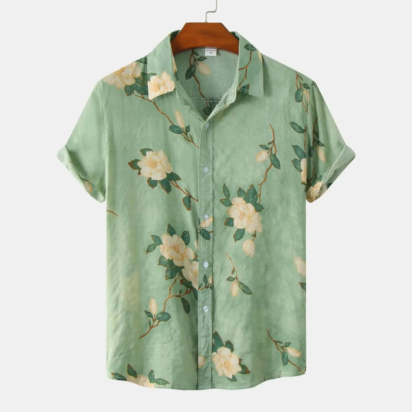 Men's vibrant Amalfi floral button-up shirt; short sleeve, relaxed fit, with green, yellow, red, brown summer patterns.