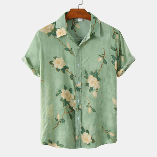 Men's vibrant Amalfi floral button-up shirt; short sleeve, relaxed fit, with green, yellow, red, brown summer patterns.
