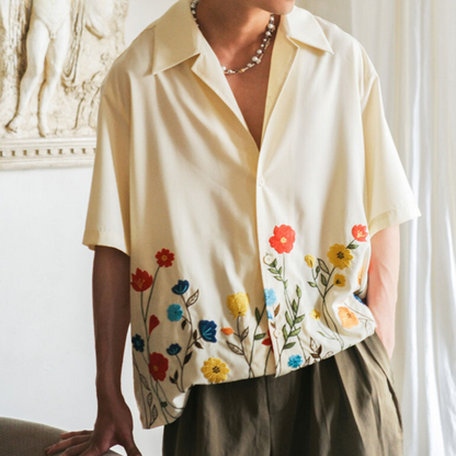 Men's vibrant floral button-up shirt, short sleeve, perfect for summer casual wear & resort.