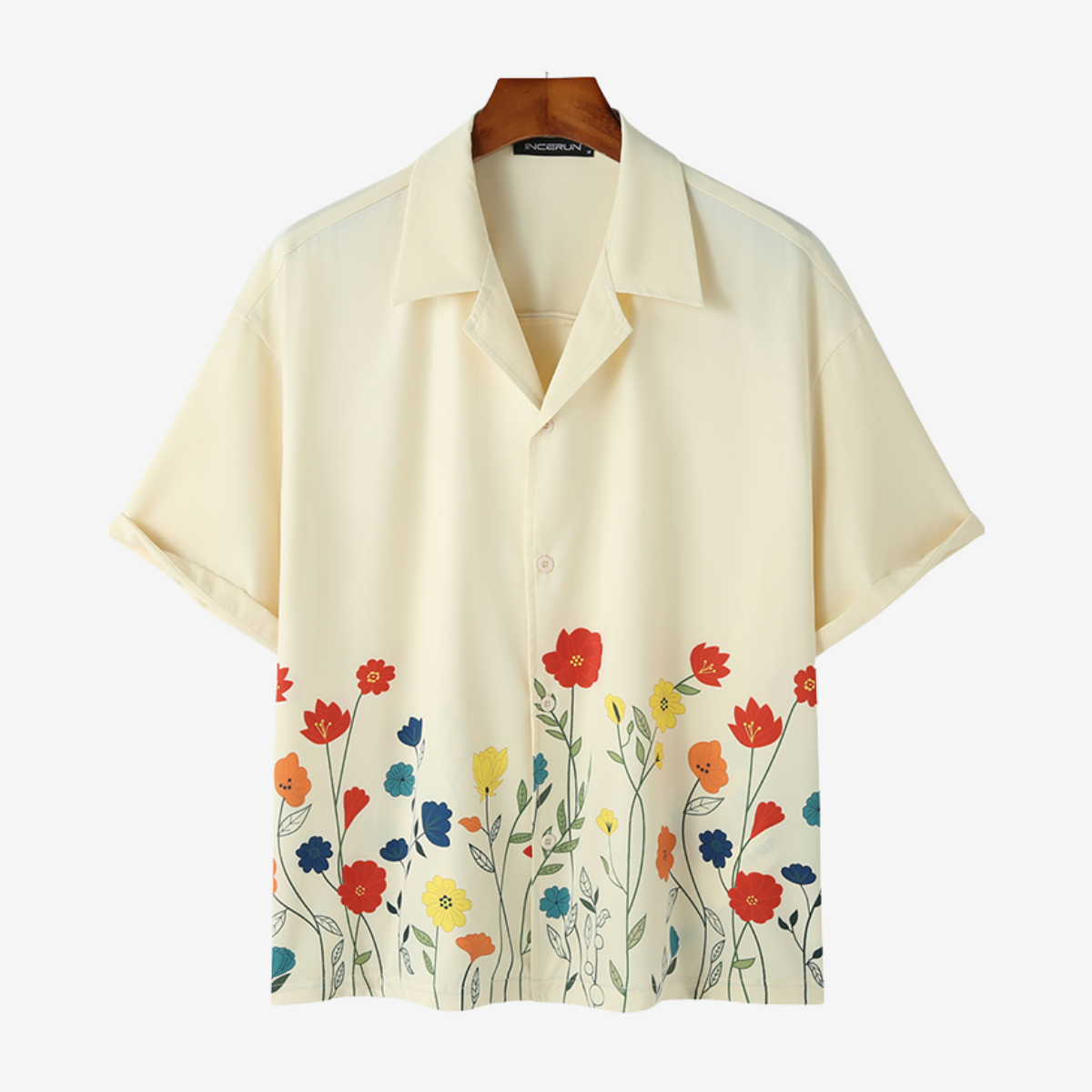 Close-up of vibrant floral print on a stylish men's short sleeve button-up shirt for summer fashion.