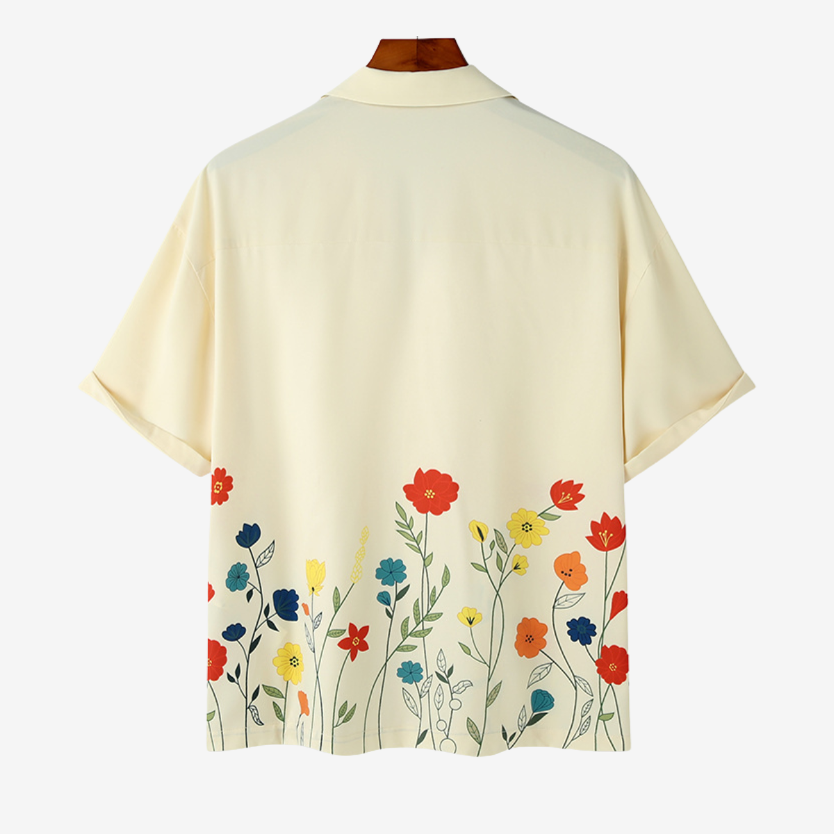 Stylish man wearing a vibrant floral short sleeve button-up shirt, ideal for summer casual & holiday wear.