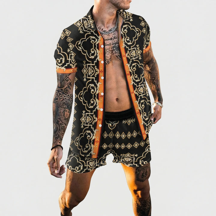 Man wearing a vibrant graphic printed two-piece summer set, relaxed fit shirt & shorts for vacation.