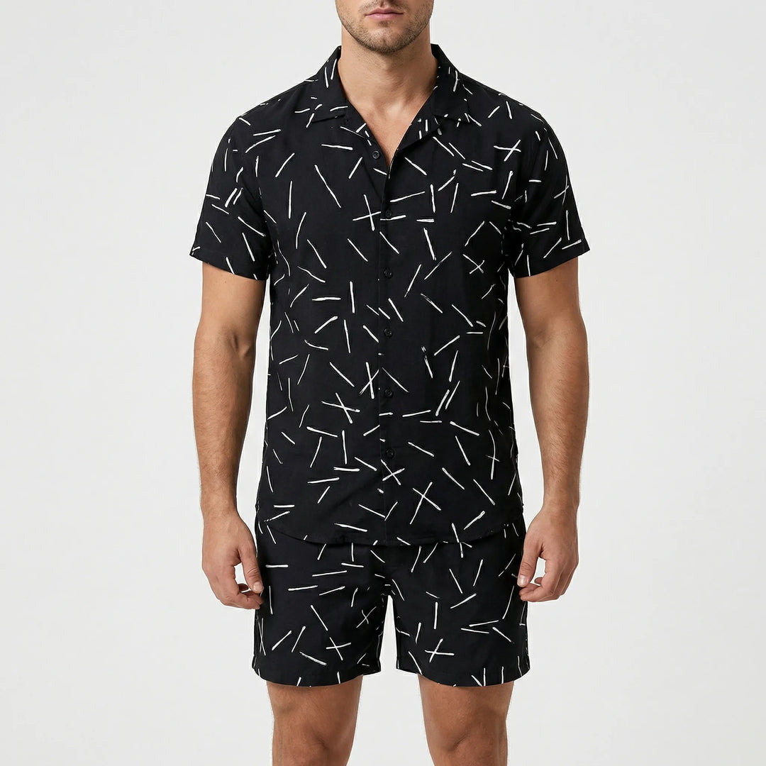 Close-up of vibrant graphic print on men's relaxed fit summer shirt & shorts two-piece set.