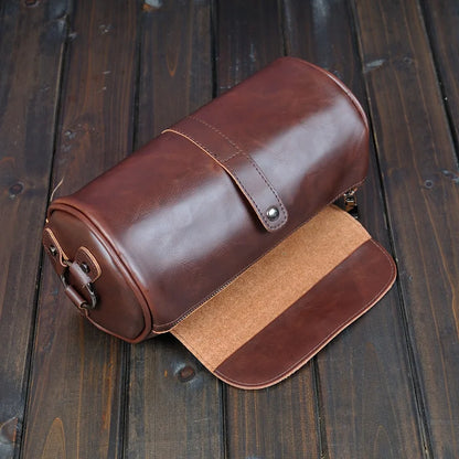 Stylish & durable men's vintage barrel shoulder bag. PU leather cross-body travel accessory for men.