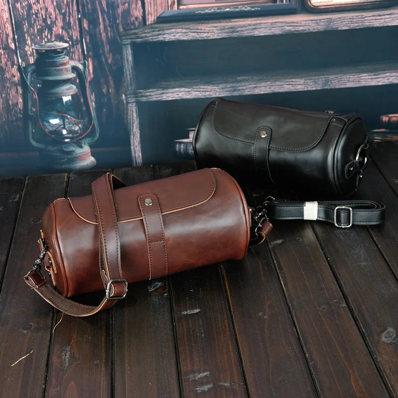 Versatile men's vintage PU leather barrel shoulder bag. Durable cross-body travel accessory for stylish men.