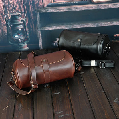 Versatile men's vintage PU leather barrel shoulder bag. Durable cross-body travel accessory for stylish men.