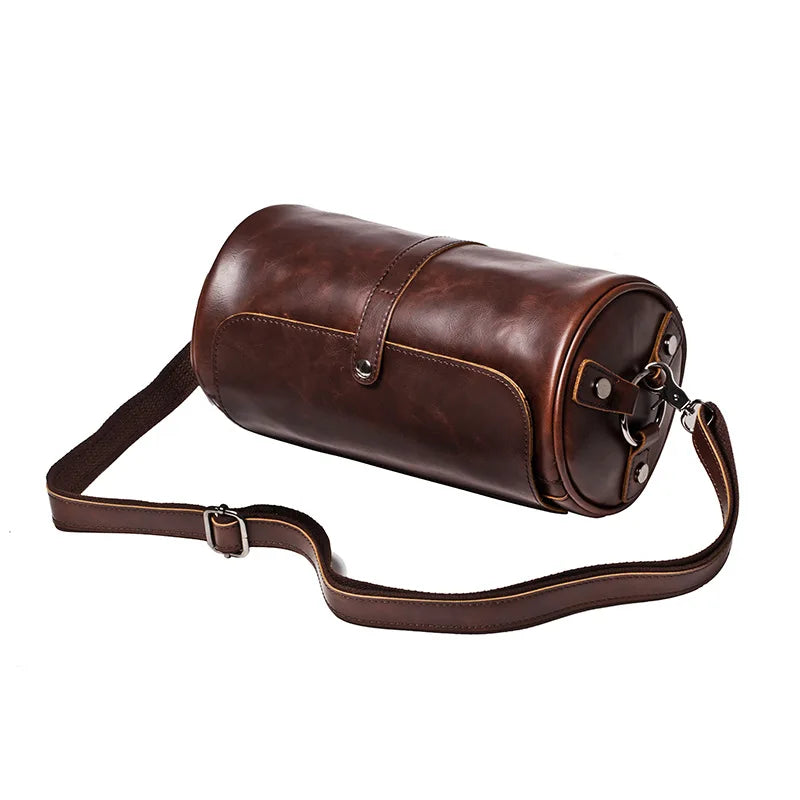 Classic men's vintage barrel shoulder bag. Durable PU leather cross-body, stylish travel accessory.