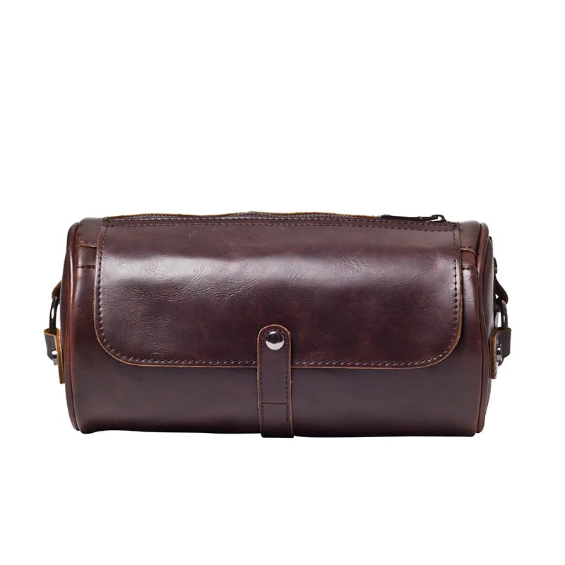 Essential men's vintage barrel shoulder bag. Durable PU leather cross-body, stylish travel accessory.