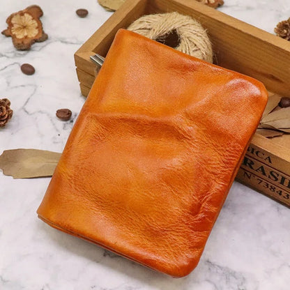 Men's vintage leather bifold wallet on a desk, a durable and stylish everyday carry item. Gift idea.