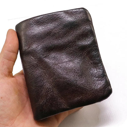 Closed view of men's rugged vintage leather bifold wallet, highlighting secure snap closure.
