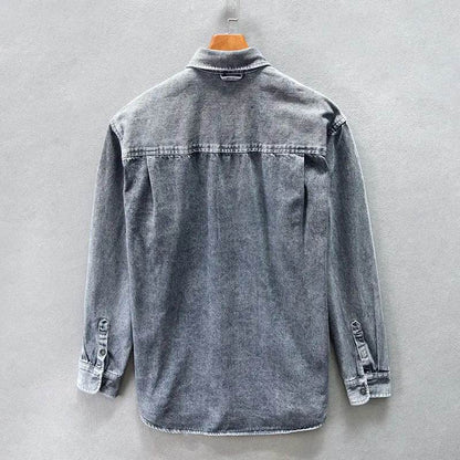 Classic men's stone-washed button-down shirt with a relaxed fit, featuring vintage style and long sleeves.