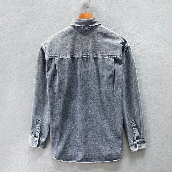 Classic men's stone-washed button-down shirt with a relaxed fit, featuring vintage style and long sleeves.