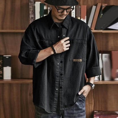 Casual men's vintage button-up shirt, long sleeve, cotton blend, a retro fashion essential.