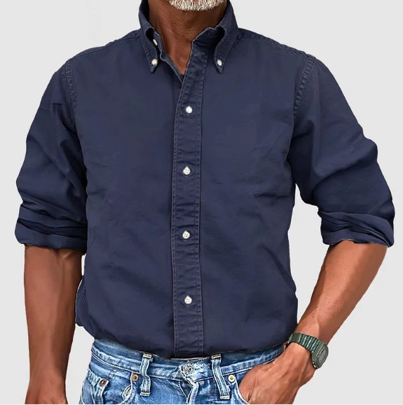 Man wearing a comfortable vintage wash long sleeve button-down shirt, perfect for a relaxed casual look.